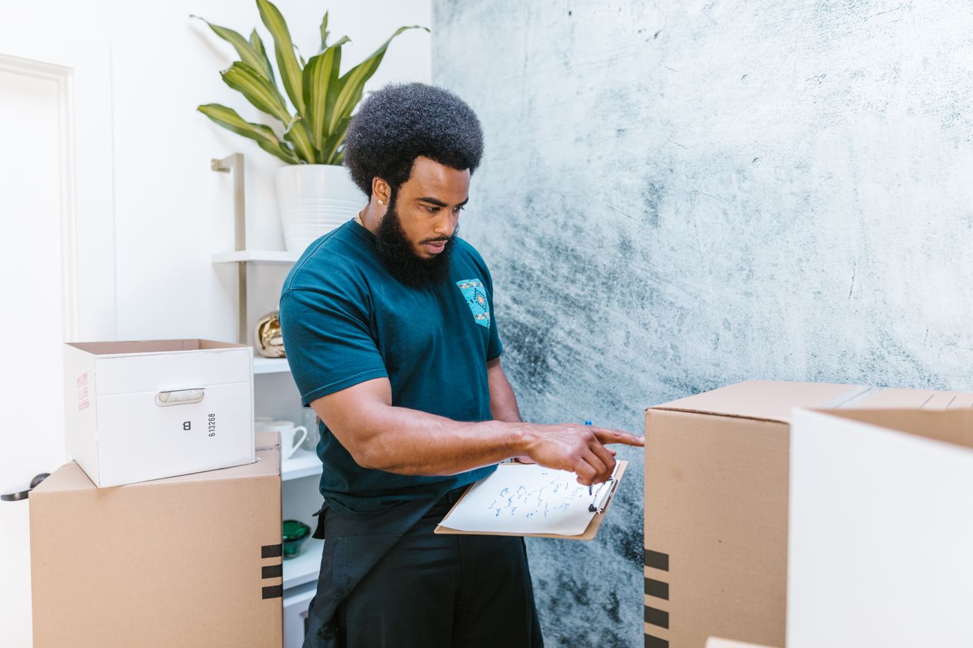 A mover checking a written inventory